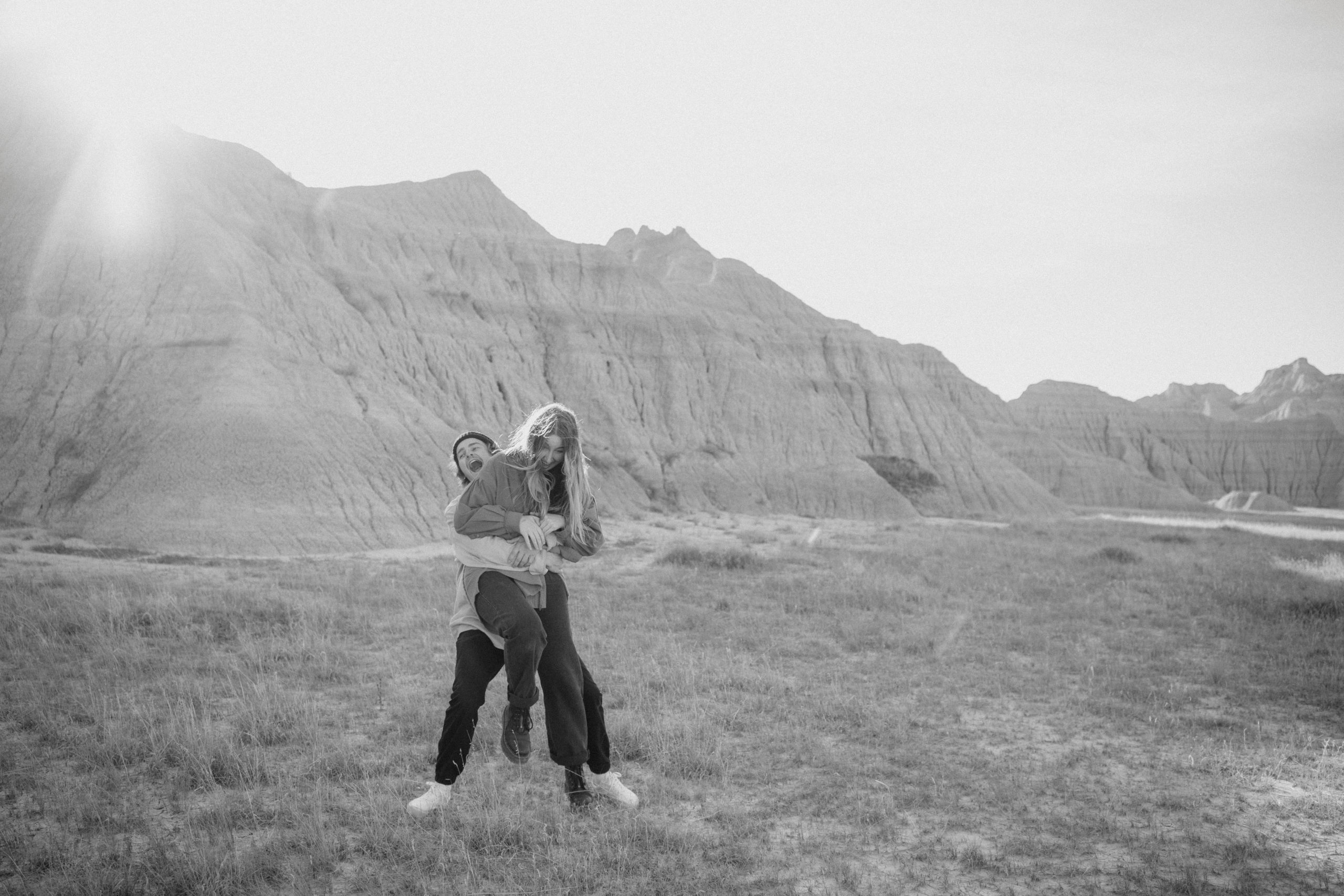 Couple taking engagement photos in Badlands National Park.