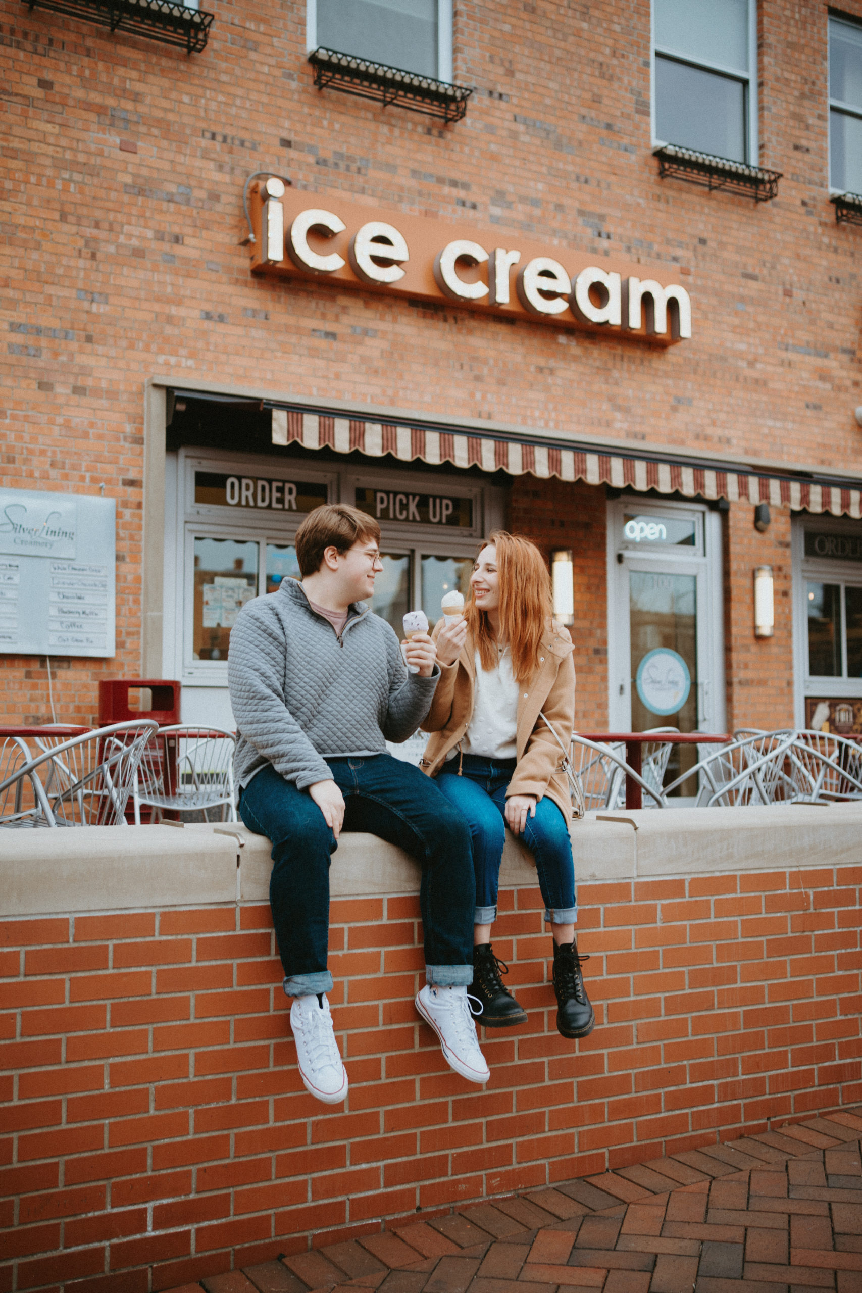 Couple eating ice cream during their Rapid City engagement session.